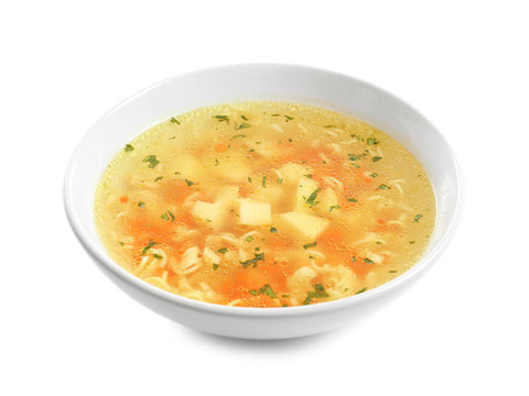 Hot vegetable soup with noodles in bowl on white background. Healthy food