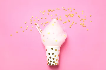 Crédence de cuisine en verre imprimé Bonbons Cup with yummy cotton candy and sprinkles on color background, top view