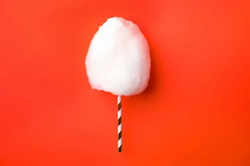 Papier Peint photo Lavable Bonbons Straw with yummy cotton candy on color background, top view