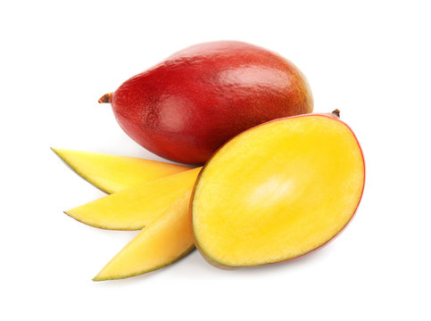 Delicious ripe mangoes on white background. Tropical fruit