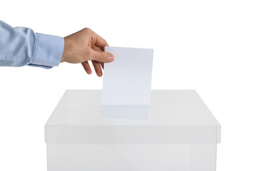 Man putting his vote into ballot box on white background, closeup