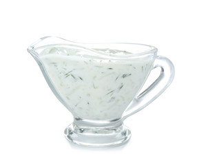 Glass gravy boat with cucumber sauce on white background