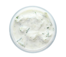 Bowl with cucumber sauce on white background, top view