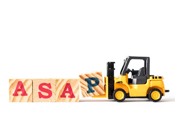 Toy forklift hold letter block p to complete word ASAP (abbreviation of as soon as possible) on white background