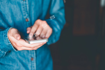 Businessman using mobile online icon social networking connection on screen