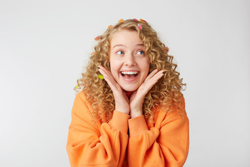 Close up of joyful smiling lovely tender nice blonde looks to the rightside feels excited,...