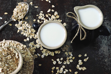 Oat milk and oatmeal. Flat Lay. Vegan drinks. The concept is not animal milk.