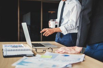 Co-working Business Team meeting Planning Strategy Analysis investment and saving concept. meeting discussing new plan financial graph data on Laptop.