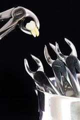 dental instruments. surgery. medical instruments with a torn tooth. installation (a tool with a torn tooth nourishes other tools) the day of the dentist. Day of the medical worker.