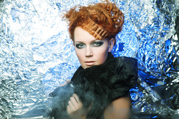 redhair woman on silver background