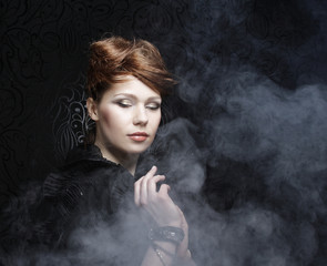 young and sexy woman in smoke 