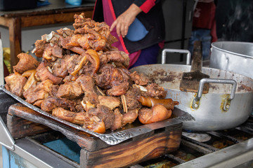 Fried pork, fried on the street in a vat is the national dish of Indians in South America -"Fritada". Ecuador.