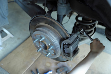 Disc brake rotor and pads on a vehicle