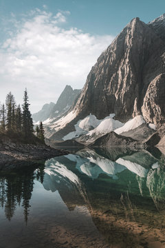 The Rockwall reflected in Floe Lake