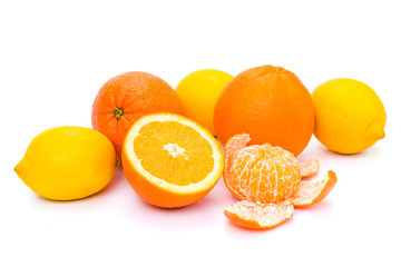 oranges, lemons and tangerines on a white background. Isolate Fruits. Citrus