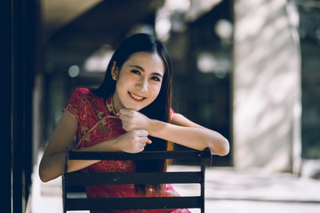 Cute girl with cheongsam traditional Chinese dress on Chinese new year.