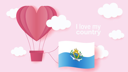 Hot air balloons in shape of heart flying in clouds with national flag of San Marino. Paper art and cut, origami style with love to San Marino