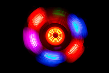 Concept of speed - Trail of fire and smoke - Vinyl record. Burning vinyl disk. Turntable vinyl record player. Retro audio equipment for disc jockey. Sound technology