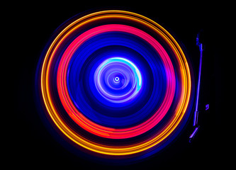 Concept of speed - Trail of fire and smoke - Vinyl record. Burning vinyl disk. Turntable vinyl record player. Retro audio equipment for disc jockey. Sound technology