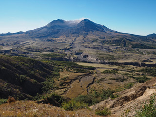 Mount Saint Helens in Washington State as seen from the Johnstin Ridge Observatory Boundary Trail on a clear, cloudless autumn morning.