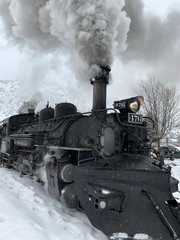 Fototapeta na wymiar 476 Narrow Gauge Steam Engine Train in snow