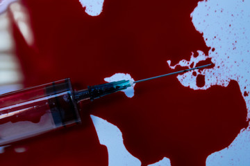 syringe in blood 