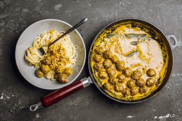 Meatballs in creamy sauce with spaghetti. Selective focus. Shallow depth of field. 