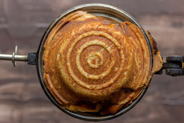 toasted jaffle in a jaffle maker 