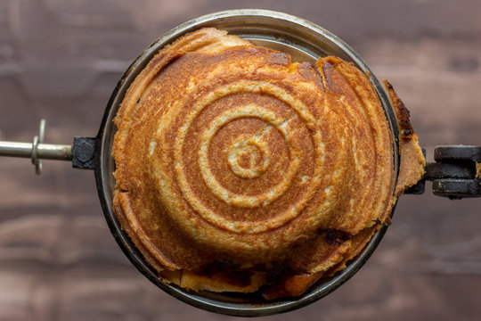 toasted jaffle in a jaffle maker 