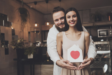 Portrait smiling couple in love standing embracing