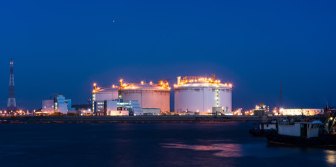 A large oil-refinery plant with Liquefied Natural Gas (LNG) storage tanks