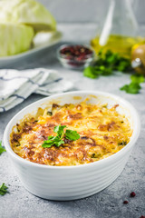 Cheesy suffed cabbage and mushroom casserole. Selective focus, space for text.