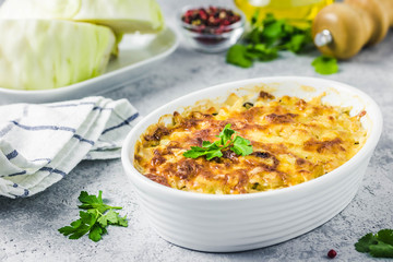 Cheesy suffed cabbage and mushroom casserole. Selective focus, space for text.