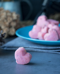 Kleeb Lamduan,Thai shortbread cookies heart shape in blue plate on black background for love issue.