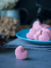 Kleeb Lamduan,Thai shortbread cookies heart shape in blue plate on black background for love issue.