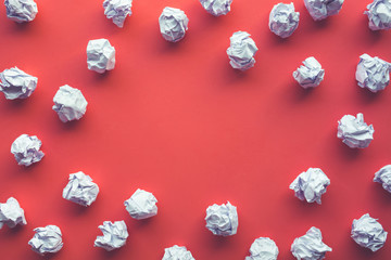 Creativity inspiration,ideas concepts with paper crumpled ball on red color