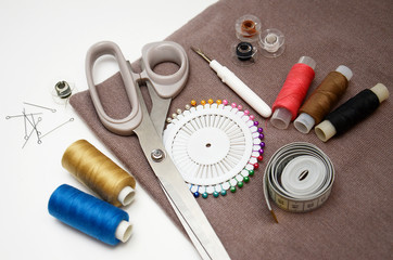 sewing kit fabric and accessories on a light background