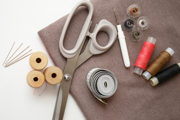 sewing kit fabric and accessories on a light background