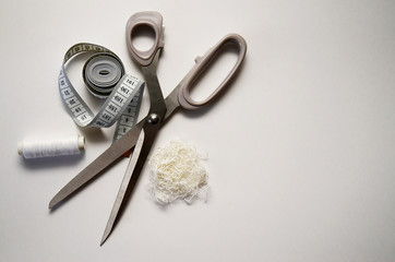 sewing kit fabric and accessories on a light background