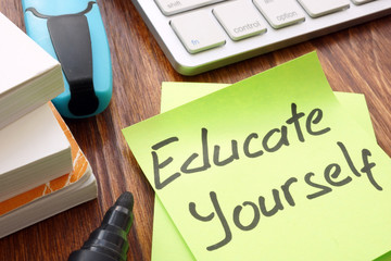 Lifelong learning concept. Sign educate yourself on a memo.
