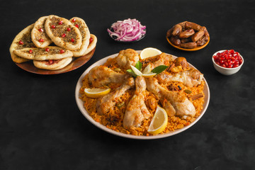 Obraz na płótnie Canvas Qatari Chicken Majboos - national dish of Bahrain and Qatar. Arabic cuisine. 