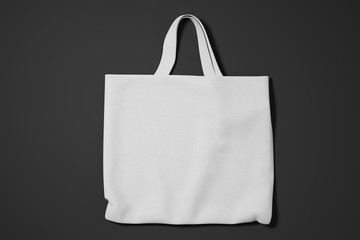 Fabric white cotton shopping bag on black background. Mock Up. 3d rendering