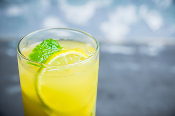 Fresh pineapple mojito on rustic background. Selective focus. Shallow depth of field.