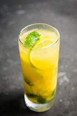 Fresh pineapple mojito on rustic background. Selective focus. Shallow depth of field.