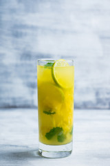 Fresh pineapple mojito on rustic background. Selective focus. Shallow depth of field.