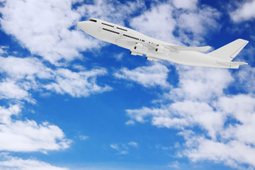 Fototapeta na wymiar White Jet Passenger's Airplane in the Sky with Clouds. 3d Rendering