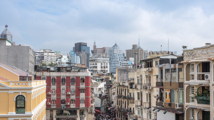 Ancient buildings crowded in attractions town with skyscraper in business district