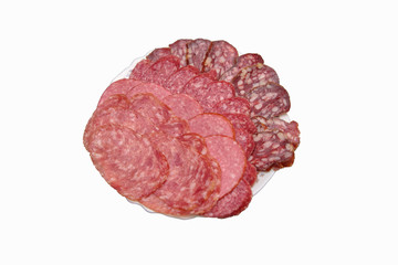 Plate with sliced sausage slices of different varieties, background and texture