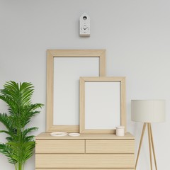 realistic home interior 3d render of two a1 and a2 empty poster mockup template with vertical wooden frame sitting on modern drawer in living room in front camera view