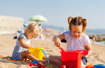   girls playing on  beach